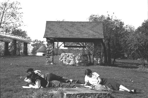 Students studying by the wishing well, 1950s