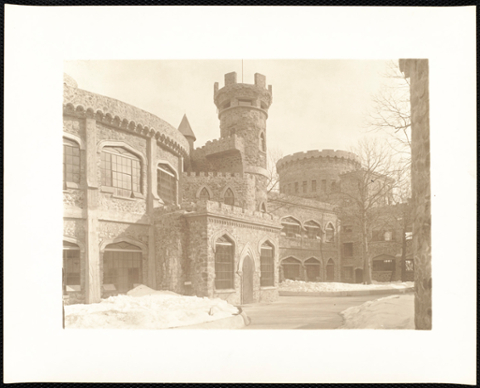 Front of castle with snow and cleared walkway.