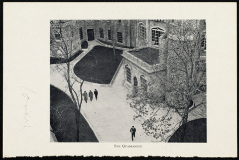 Aerial view of the quadrangle with 4 students walking along the paths.