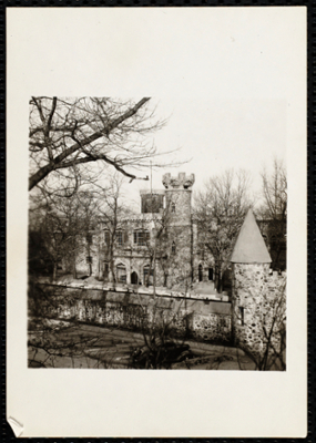 Full view of Castle with stone wall.