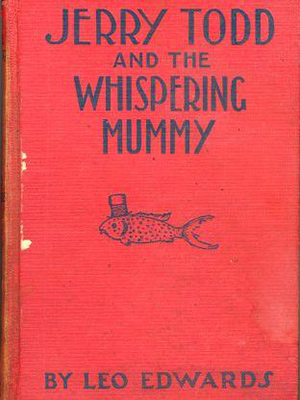Cover of book "Jerry Todd and the Whispering Mummy." Cover has small illustration of a fish wearing a hat on a red cover.