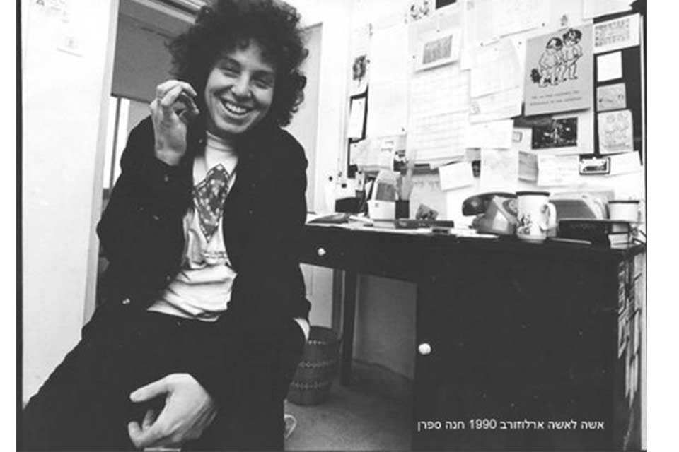 Hannah Safran smiling and sitting at a desk