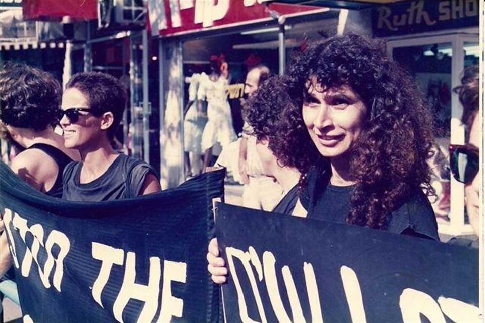 Several women holding large banners from Haifa Women in Black.