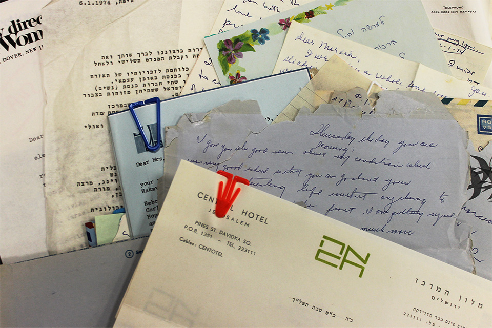A stack of handwritten and typed correspondence written to Marcia Freedman