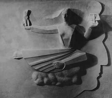 Relief in Nathan Seifer Auditorium depicting a woman sitting on a cloud with both arms extended. One hand holds the scales of justice; the other holds a kneeling figure with head lowered, hands covering the face seemingly in anguish.  Behind the figure is a large profile of a face that extends the entire height of the woman's body. The artist's signature and date are carved in the lower left. George (last name not legible). 1950.