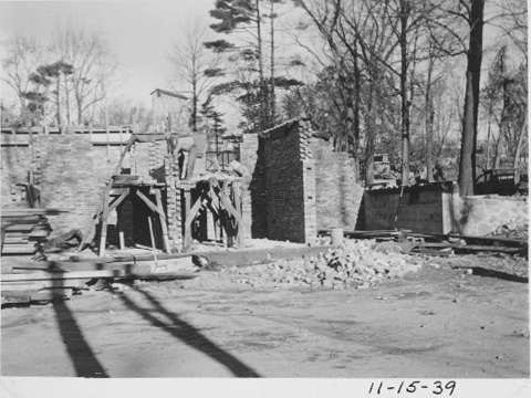 Construction on the walls in progress with a pile of bricks.