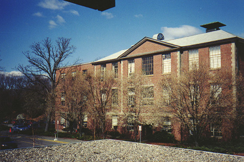 View of the front of Ford Hall. This is a color photograph in the spring with bare trees.