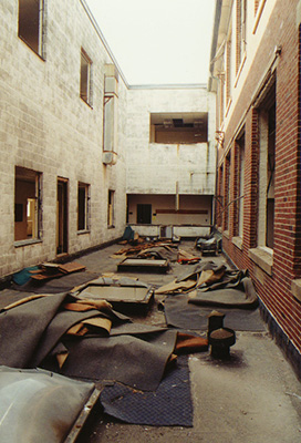 Carpets and other material lie on the second floor open-air space between Sydeman and Ford Halls