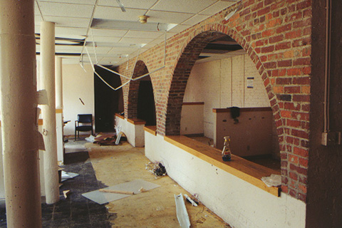 The Central Development Records Office with its archways now empty.