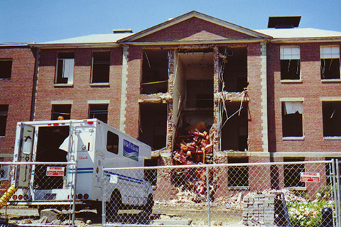 A Bell Atlantic truck standing in front of the building to reroute the telecommunications equipment.