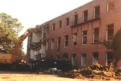 Wrecking crew tearing down Sydemann Hall.