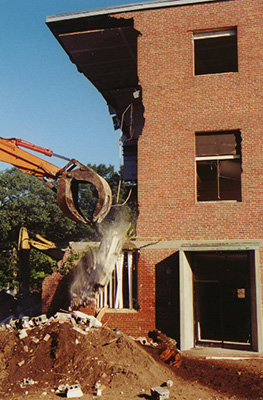 Closeup of the claw knocking down the wall.