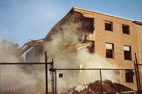 Fourth in a sequence of an excavator tearning down a corner of Sydeman Hall 