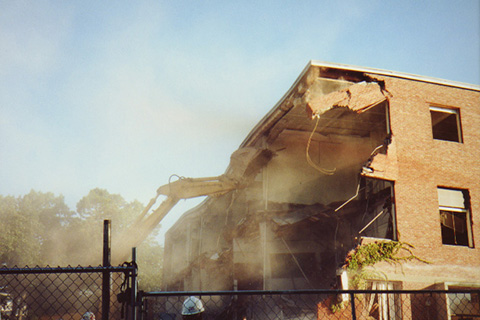 Fifth in a sequence of an excavator tearning down a corner of Sydeman Hall 