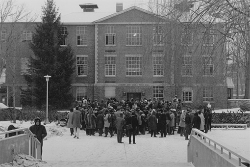Students gather in front of Ford Hall to protest