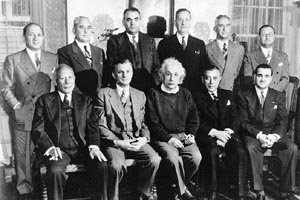 Group photo of The New England Associates of Brandeis University gathered at the home of Albert Einstein in Princeton, NJ: Abraham Shapiro, George Alpert, Albert Einstein, Ralph Lazrus, Norman Rabb in back: Sidney Rabinowitz, James J. Axelrod, Barnett Gofdon, Robert Cable, Yoland Markson and Irving Usen, March 8, 1947