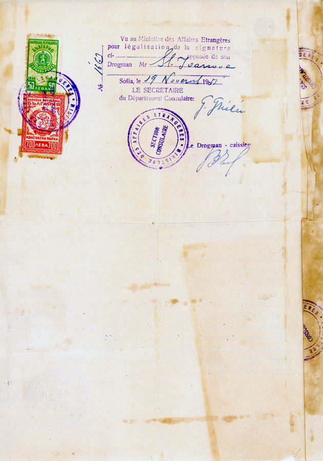 Small, purple stamped form filled out in handwriting, purple, official inked stamps.