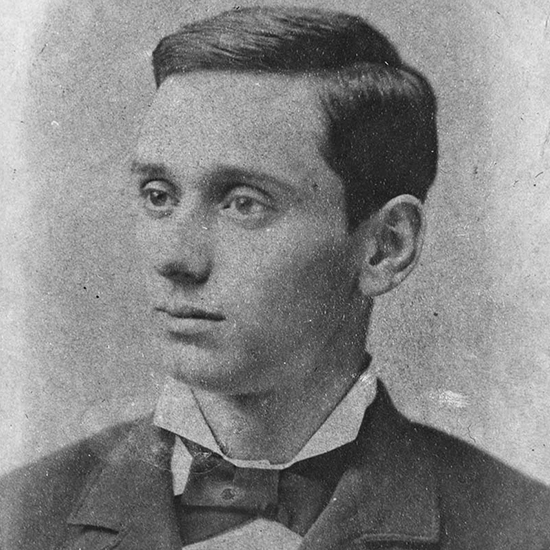 Louis Brandeis at age 20 gazing into the distance with a blazer and a dress shirt