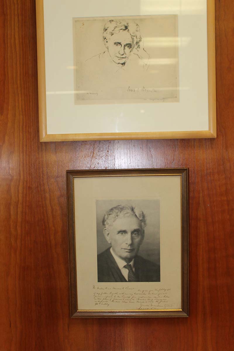 2 framed portraits of Justice Brandeis (one drawing, one photograph)