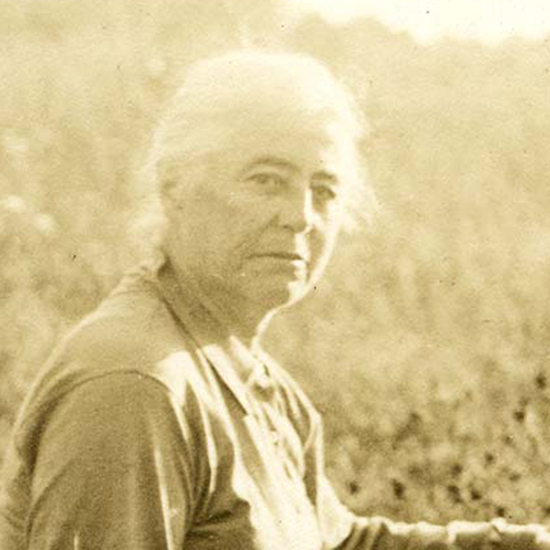 Alice G. Brandeis sitting in a field