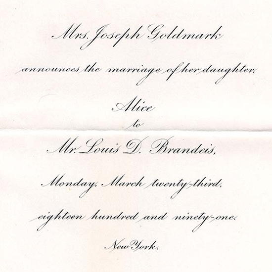 Wedding invitation. Black ink and cursive writing centered in the middle of a white page