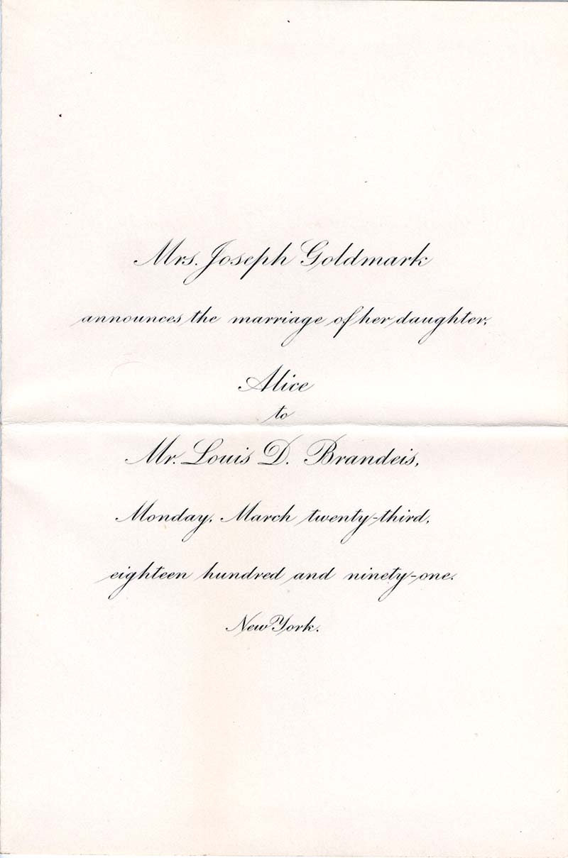 wedding invitation consisting of black ink and cursive writing centered in the middle of a white page