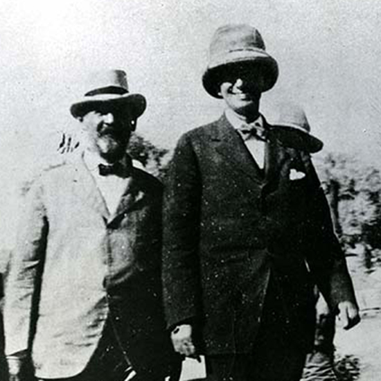 Smiling Louis D. Brandeis and Jonas Friedenwald in Palestine in the company of other men (black and white photograph)