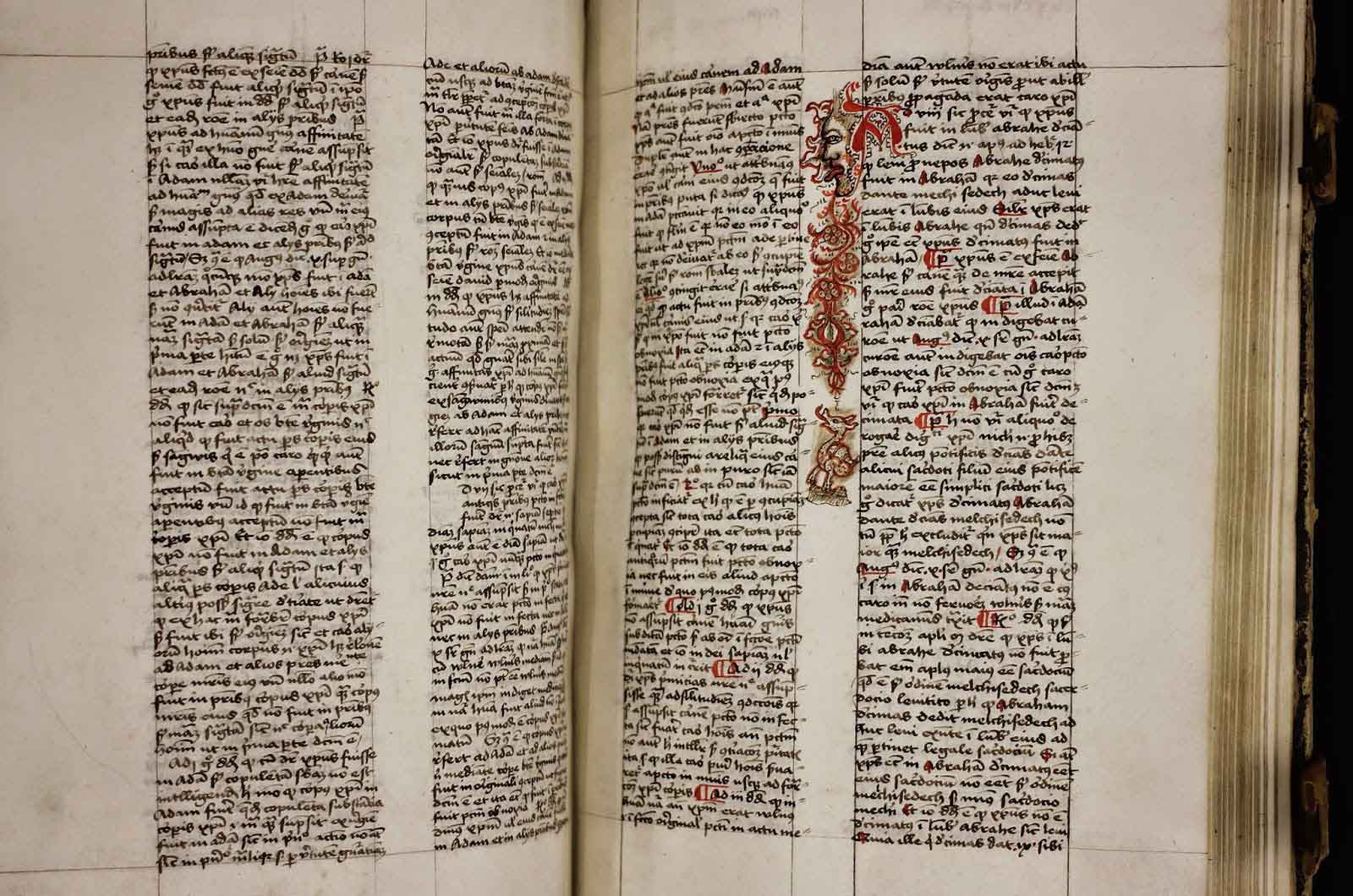 page from Aquinas' "Summa" with decorations in the margins