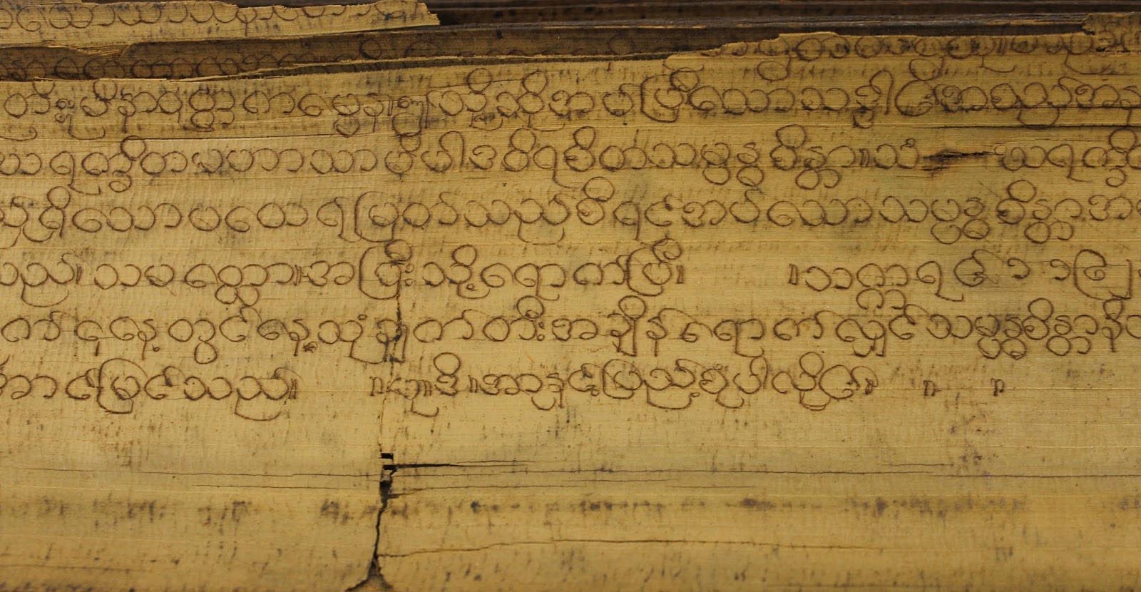Close up of hand-written Burmese text.