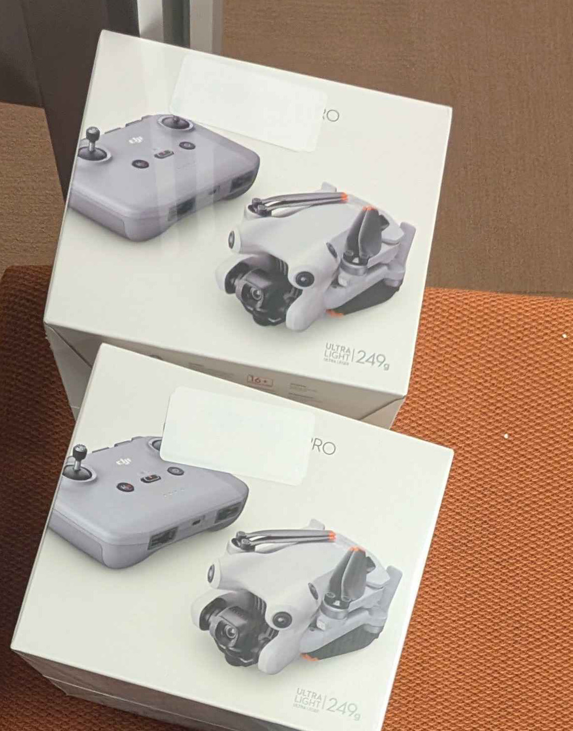 Two boxes with drone photos on them. 