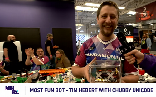 Tim Hebert holding a trophy.