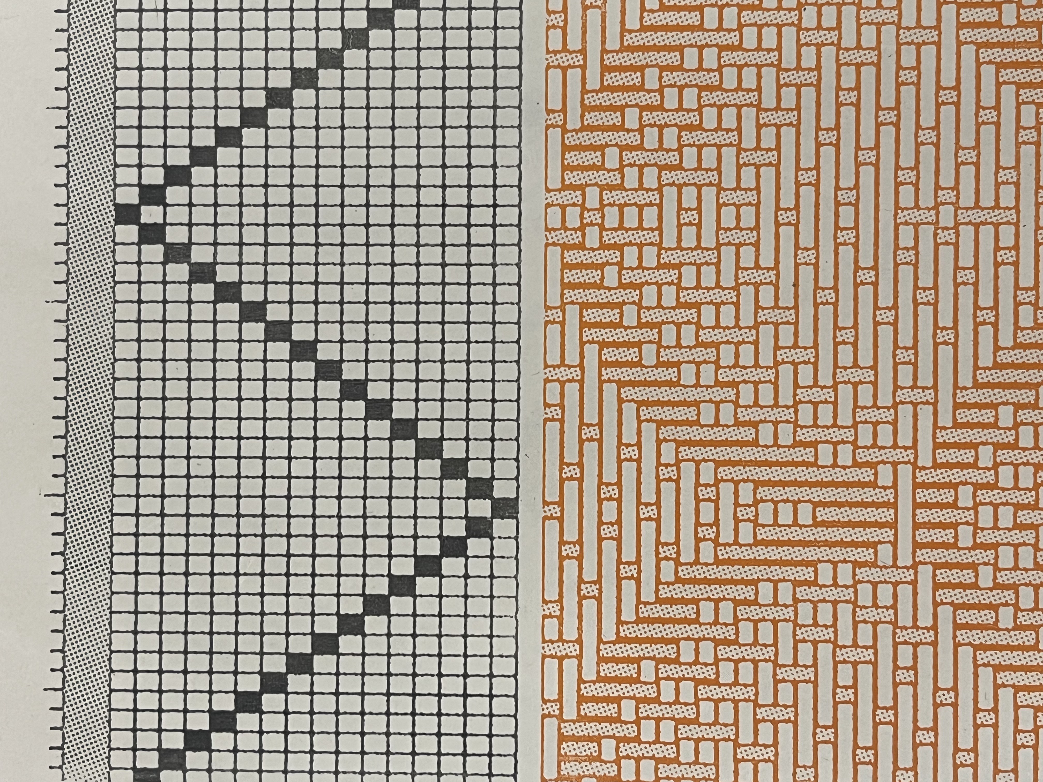 Photograph of a print coming out of a press