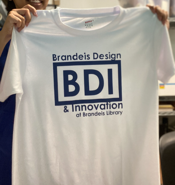 Light blue tee shirt held up.