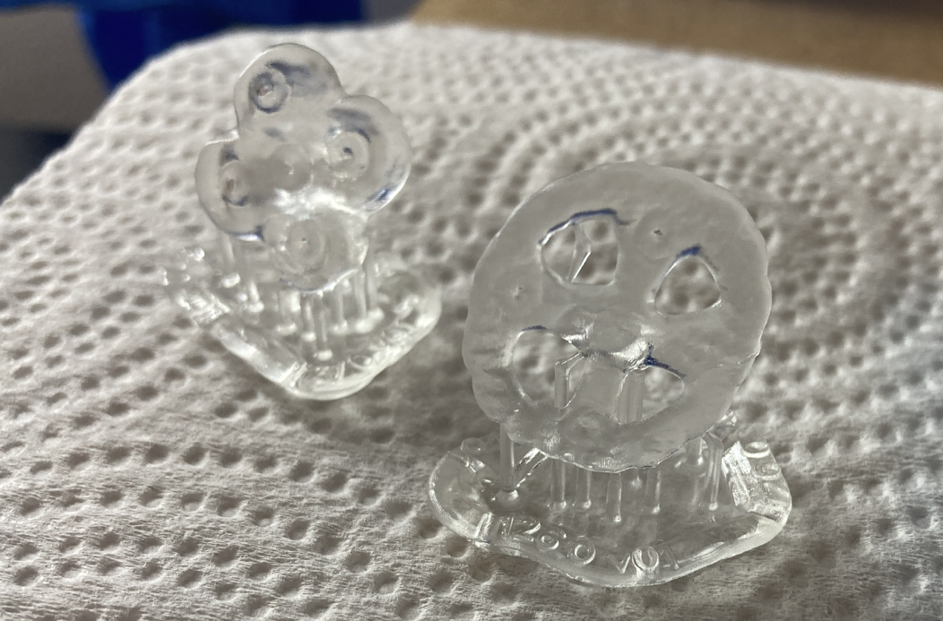 Photo of two small plastic buttons