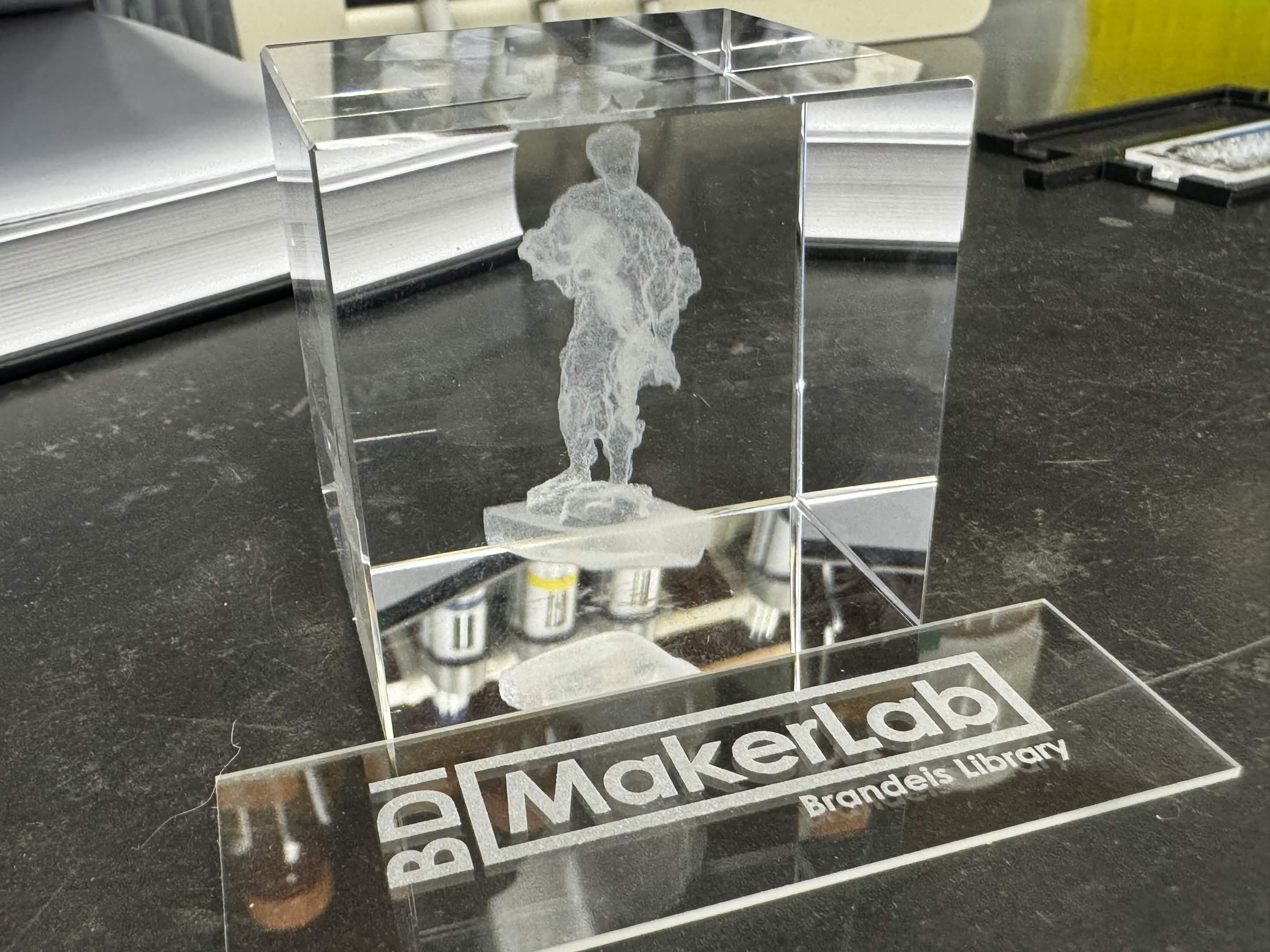 Glass cube with a man etched in the middle