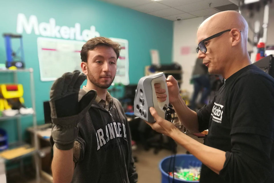 Prosthetics club member with RTI Director Ian Roy.