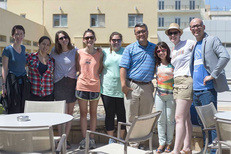Professor Andrew Koh poses in Greece with students