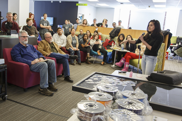 A student speaks to audience members