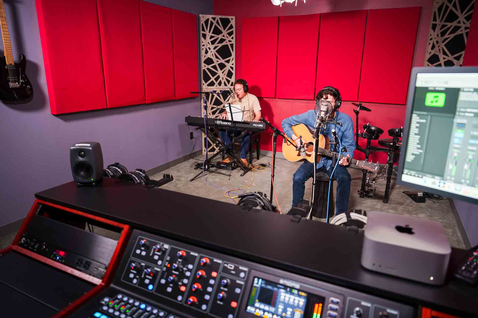 a group prepares to record a song in the studio