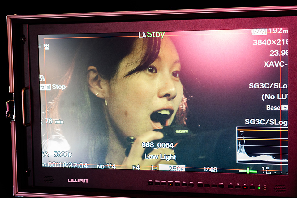 Student's excited expression on a camera monitor screen