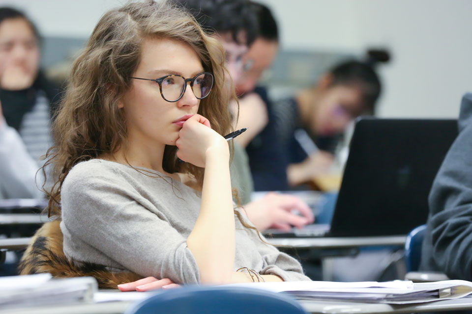 A student looks to the front of the class