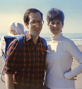 Fred and Kathy relax at the shore with baby Miriam.