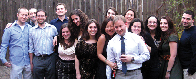 From left: Joseph Hartstone ’05, Benjamin Yudkoff ’04, Michael Gotlib ’04, Alex Thompson ’04, Brett Lowitz Gotlib ’05, Valerie Rosenberg ’05, Anna Statnikova ’04, Anna, Carolyn Barnett ’06, Brandon, Sylvie Shames ’04, Rachel Hartstein Ezra ’04, Michelle Gaba ’04, Sharon Goldsmith Weber ’04 and Jaret Weber ’00