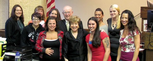 READING CIRCLE: Jean Trounstine (center) with Changing Lives Through Literature participants at their graduation ceremony, held in a courtroom.