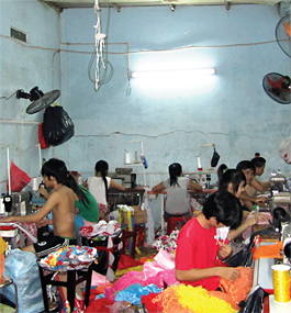 FACTORY LIFE: Young garment workers — who may eat, sleep and labor in the same room — often suffer from malnutrition, damaged eyesight or back injuries.