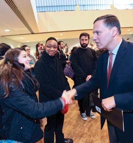 A HEARTY WELCOME: Sydney Derfel '17, from Ithaca, New York, greets Liebowitz at a reception held in the Levin Ballroom in January.