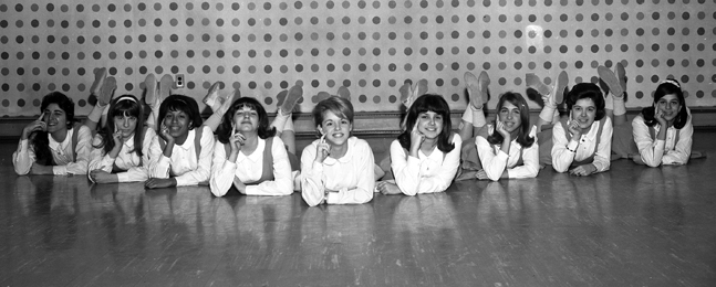 SCHOOL SPIRIT: Jefferson (third from left) joined the Brandeis cheerleading squad as a first-year student.