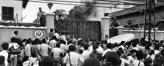 IMPLORING, NOT ANGRY: South Vietnamese civilians wait outside the U.S. embassy gate on April 29.