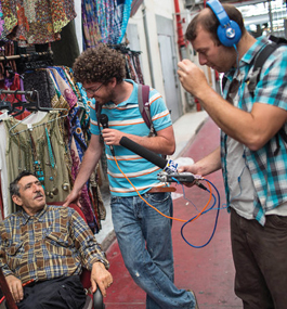 TALK OF THE SHUK: Harman and Gilron chat with locals at the flea market in Jaffa.