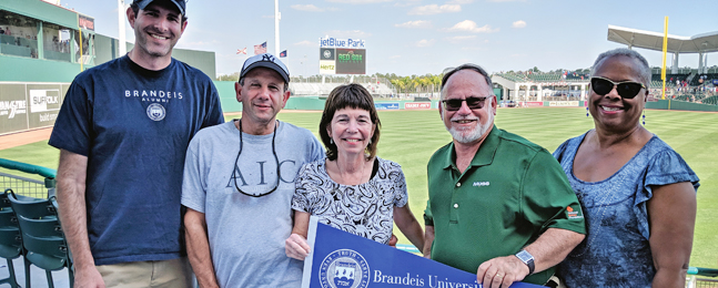 Five alumni and friends at a spring training game in Fort Myers, Florida.